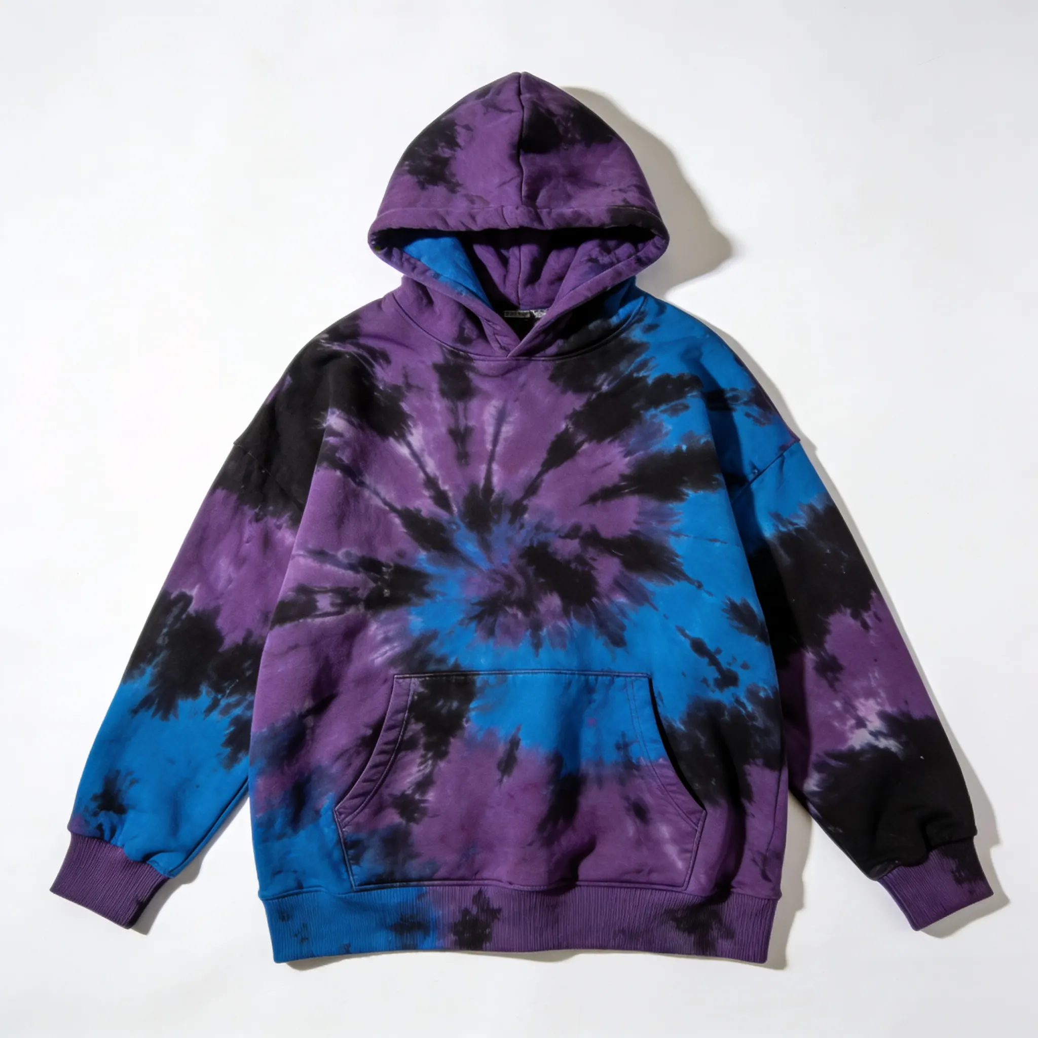 A loose-fit hoodie in a vibrant psychedelic tie-dye pattern