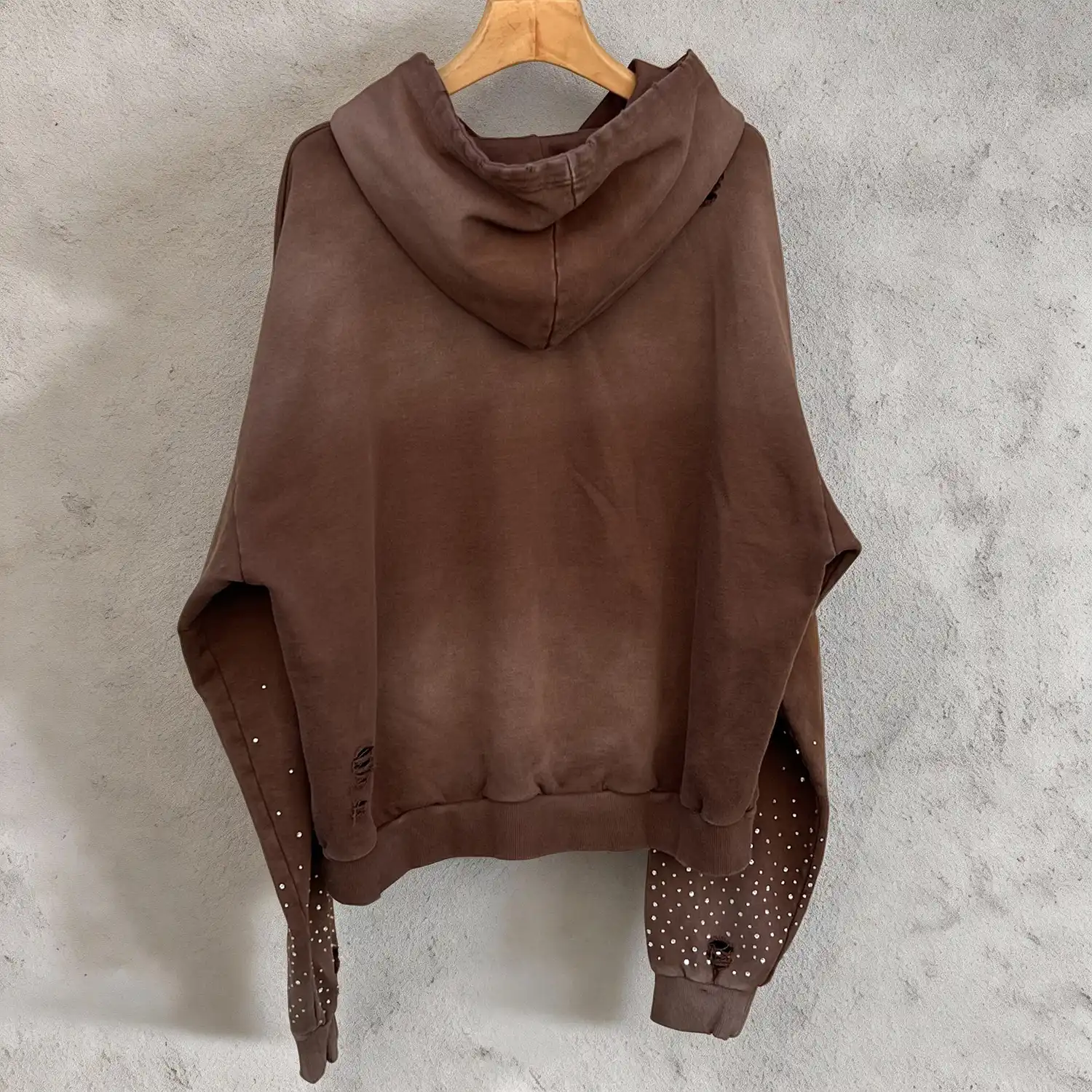 Flat lay showing bespoke mud wash fade and private label streetwear manufacturing capabilities