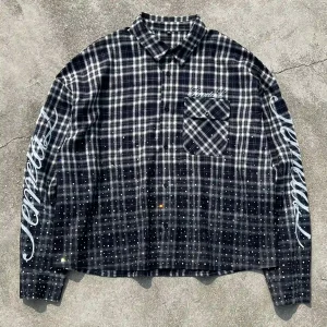 Flat lay front view of custom rhinestone washed plaid shirt blending vintage fade with luxury streetwear details