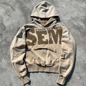 Flat lay of custom distressed french terry hoodie in vintage wash beige manufactured by Qianshiwear