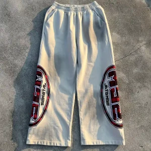 Wholesale Y2K vintage baggy sweatpants front view in washed beige with large red plaid appliqué side graphics