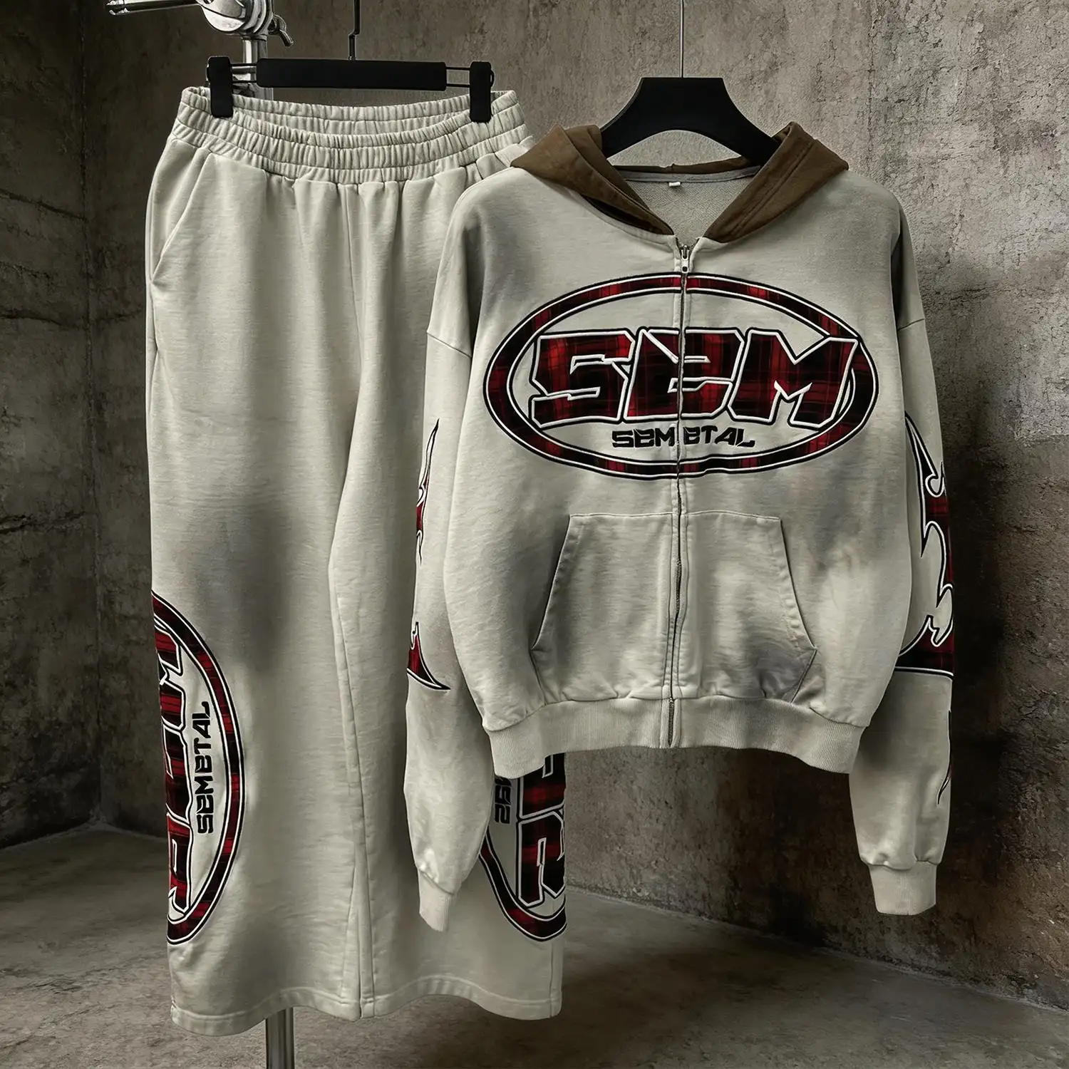 Oversized Y2K zip-up hoodie with drop shoulders and red plaid star tribal appliqué embroidery