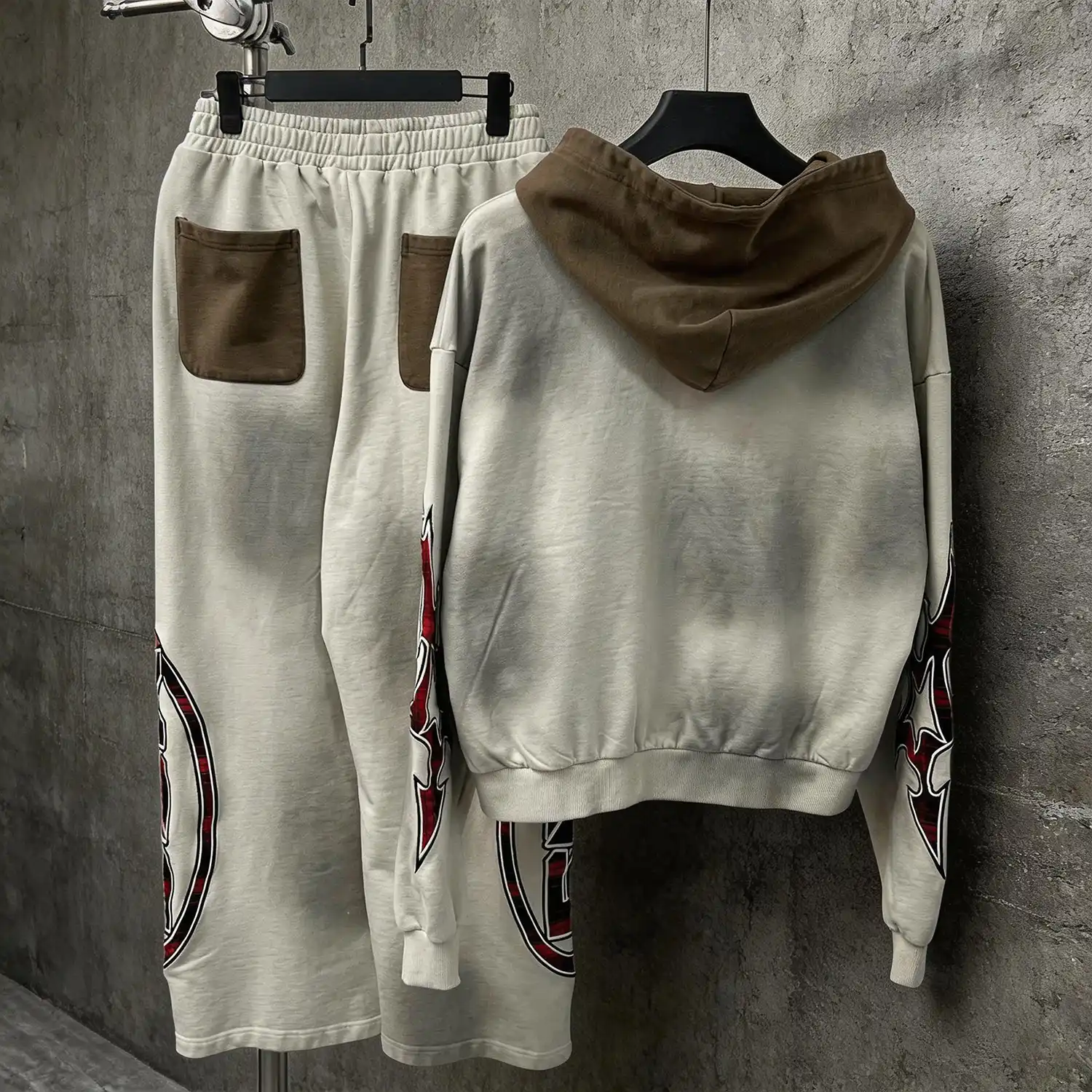 Baggy wide-leg vintage wash sweatpants with massive red plaid SEMETAL logo appliqué on the leg