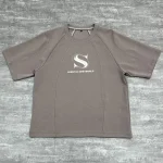 Flat lay front view of the best custom cut and sew streetwear t-shirt in taupe color