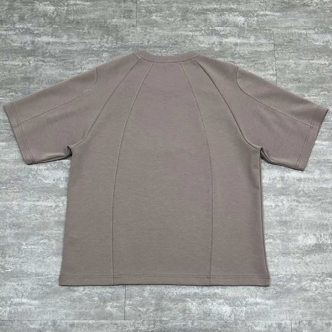 Flat lay back view showing the architectural double-needle seams on the premium heavyweight tee
