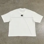 Flat lay back view of the custom woven label oversized t-shirt highlighting horizontal back seam and patch