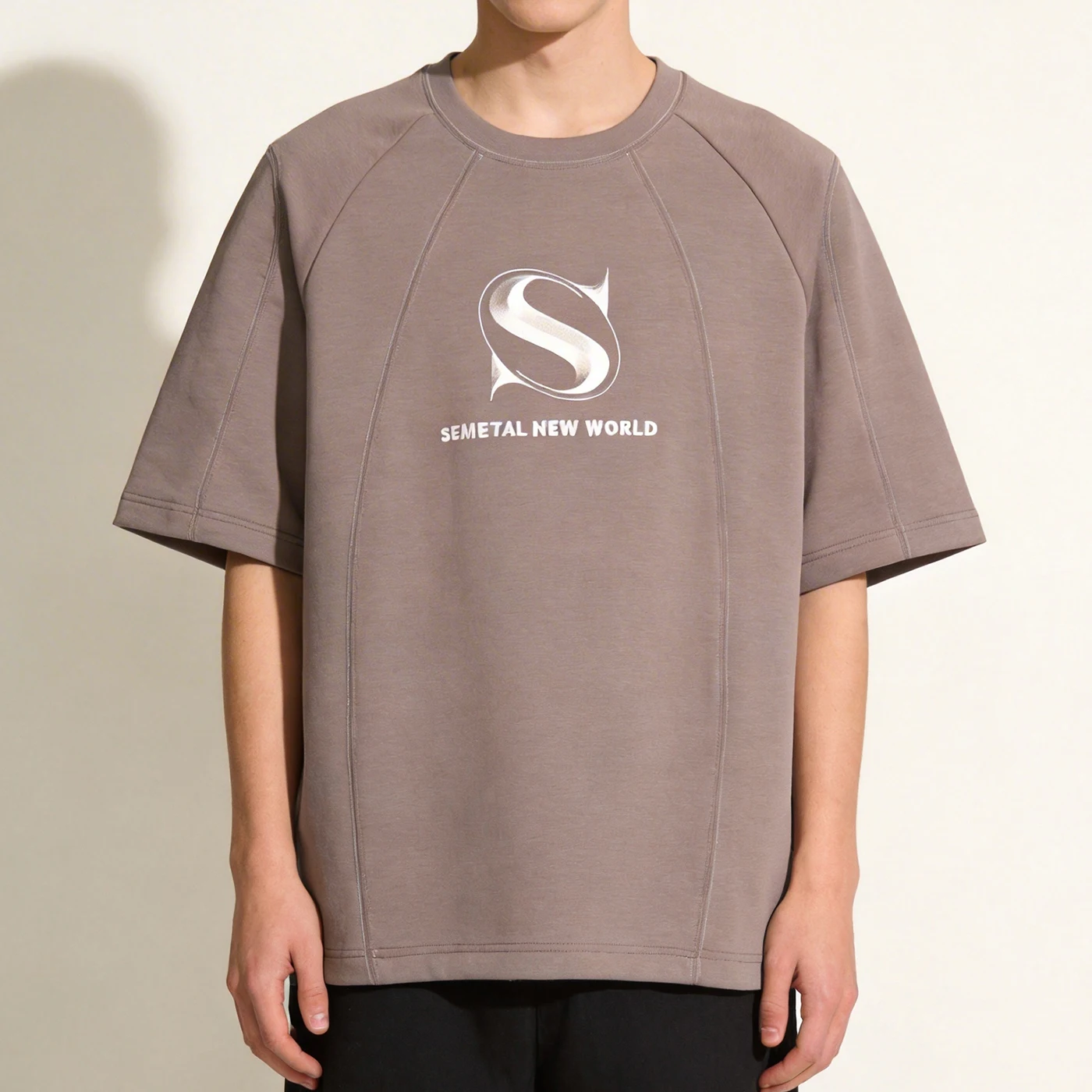 Male model wearing the custom cut and sew streetwear t-shirt showing the front fit