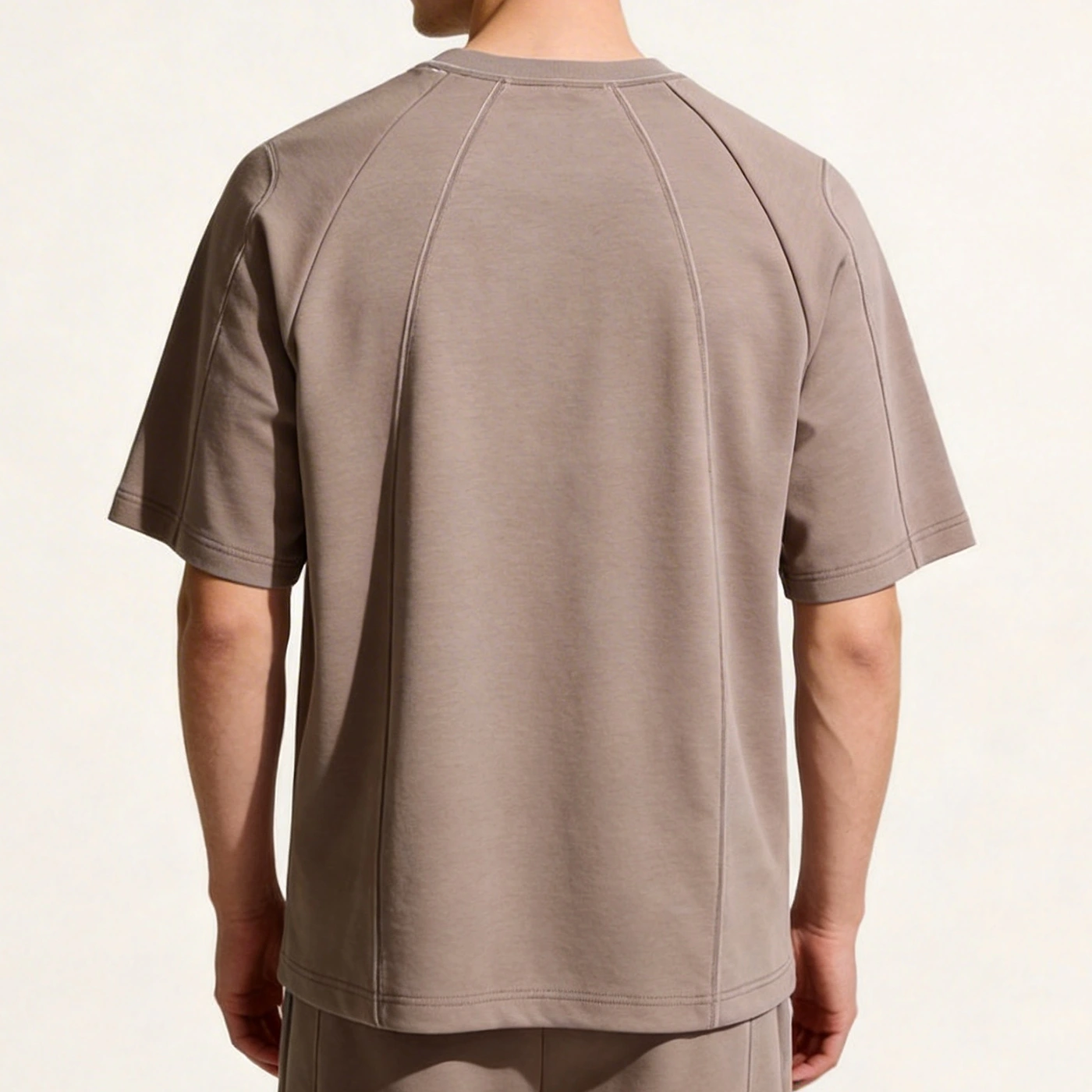 Back view of model wearing the heavyweight double-needle tee wholesale sample