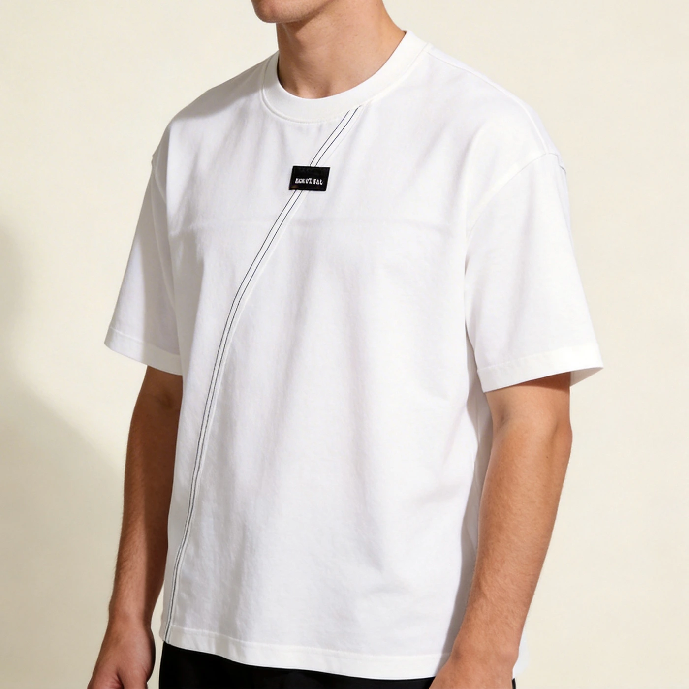 Side profile of model in the 250GSM heavyweight blank t-shirt wholesale sample displaying the boxy drop-shoulder fit