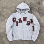 Front flat lay of heather grey custom applique zip up hoodie for streetwear brands.