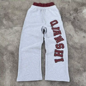 Flat lay of double waistband streetwear custom baggy fleece sweatpants.