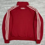 Close-up of high-density back neck star embroidery on premium custom track jacket.