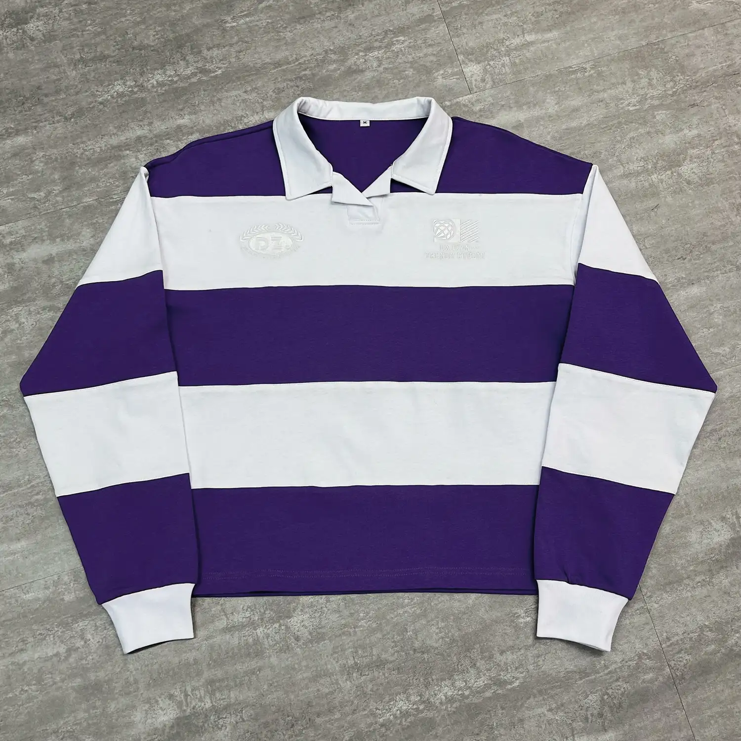 Front flat lay of purple and white custom striped polo shirt for B2B wholesale.