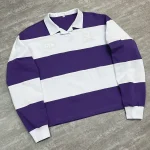 Angled flat lay highlighting the drop shoulder fit of the custom striped polo shirt.