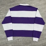 Full back view of purple and white custom striped polo shirt with twin-needle hem.