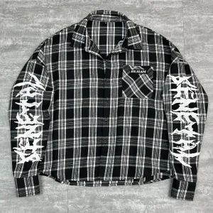 Front view of black custom oversized mesh shirt with contrast stitching