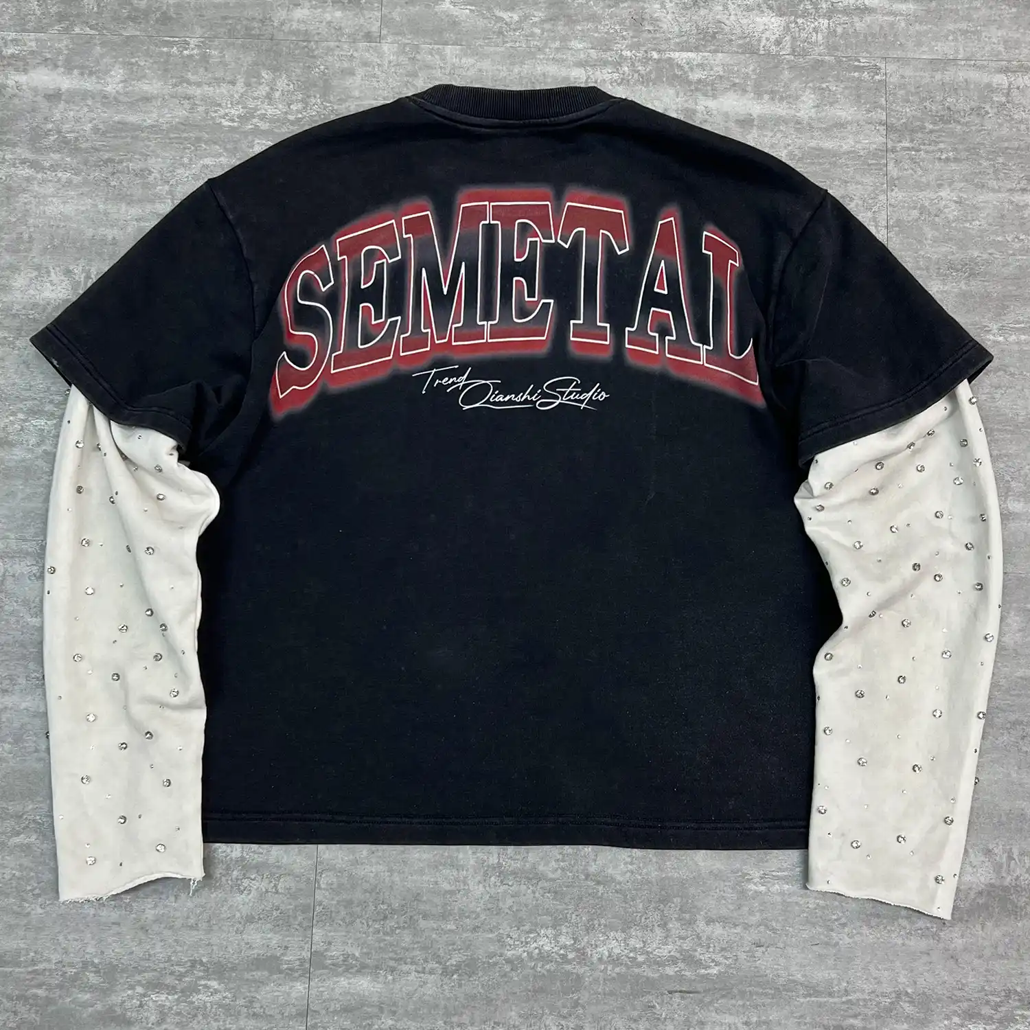 Close up of front pocket star embroidery on premium mesh streetwear shirt.