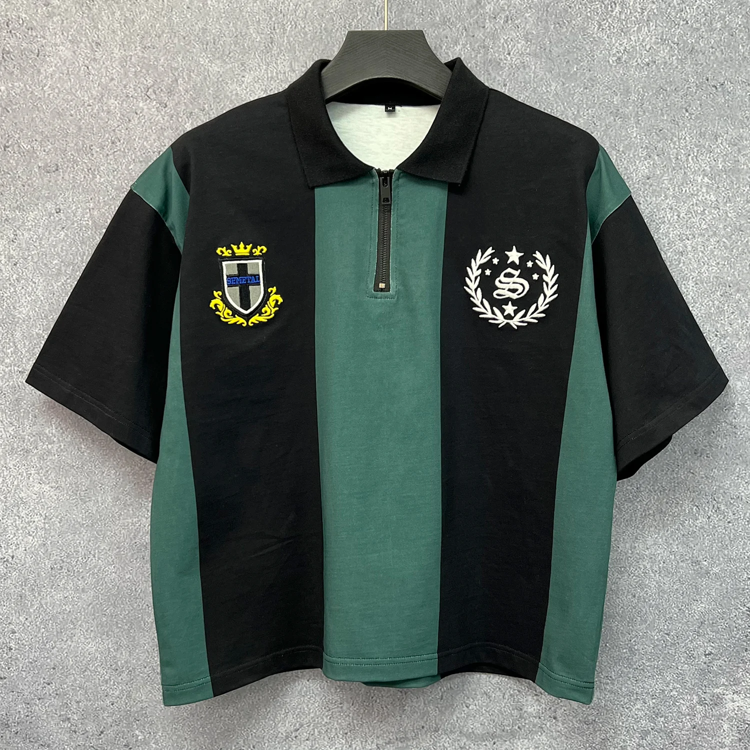 Custom Striped Polo Shirt 220GSM Cotton 50 MOQ OEM 9 Front view of custom striped polo shirt hanging on a rack for B2B apparel sourcing.
