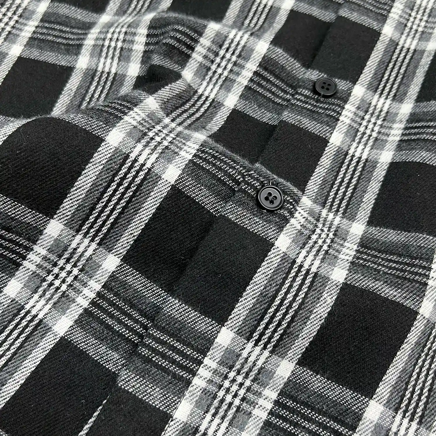 Flat lay back view showing drop shoulder fit of custom oversized mesh shirt.