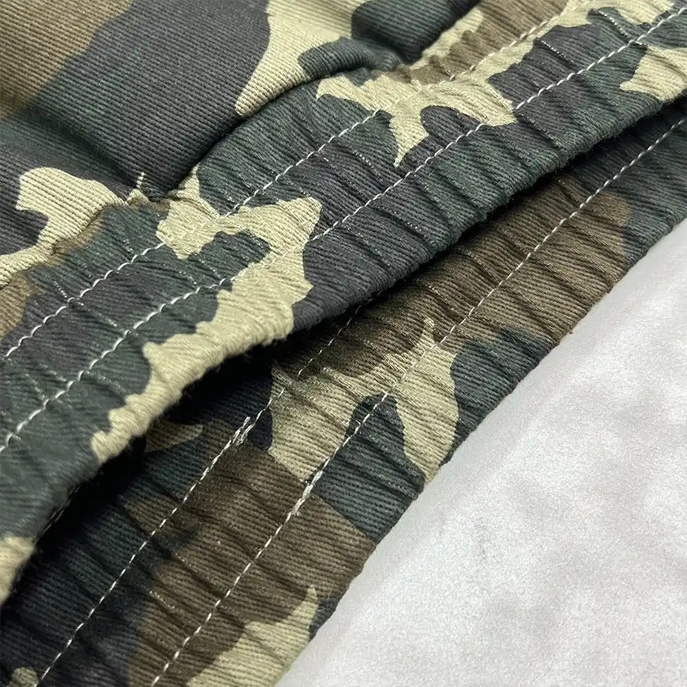 custom camo cargo pants hem stitching and twill fabric close up