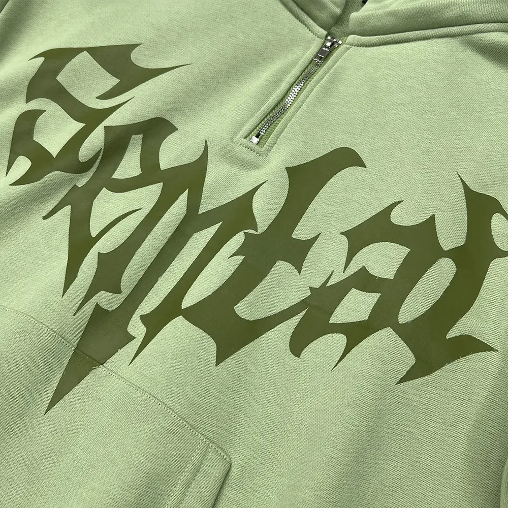 custom half zip hoodie metal zipper and gothic logo close up