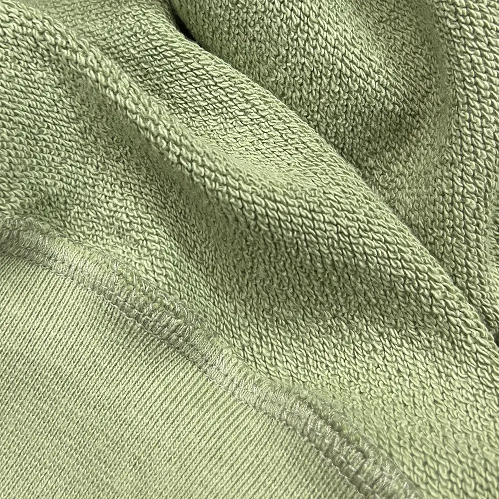 custom half zip hoodie sage green french terry fabric close up