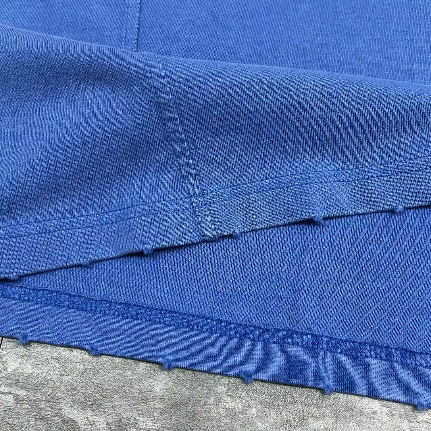 custom oversized t shirt hem stitching and distressed raw edge detail