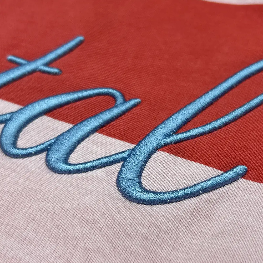 custom rugby polo shirt blue script embroidery close up