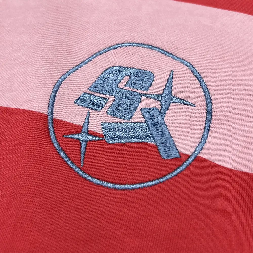 custom rugby polo shirt circular chest embroidery close up