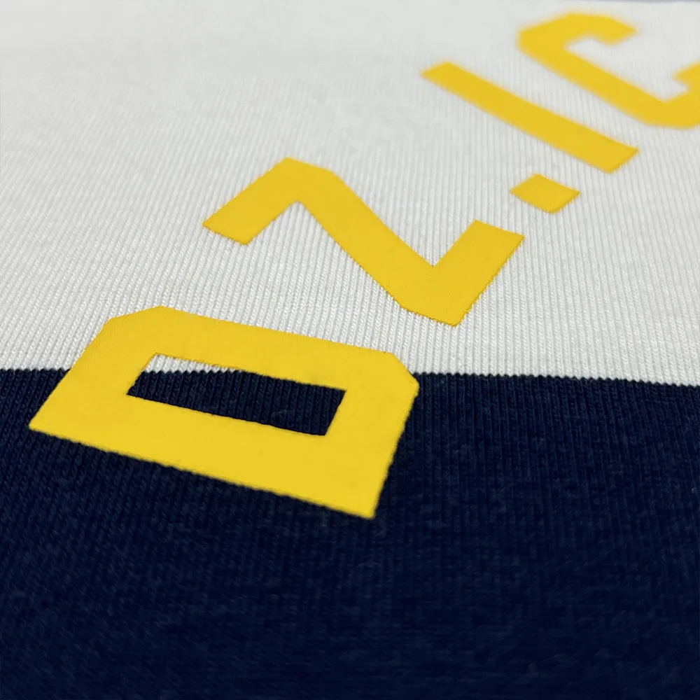 custom striped polo shirt raised yellow logo print close up